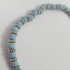 Licht blauwe en zilver kralen rek armband