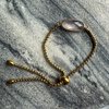 Goudkleurige armbanden met facet geslepen edelstenen