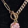 Vergulde ketting met bloem bedel - roze