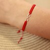Armband met 14 karaat geelgouden Infinity - met twee hartjes