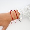 Elegante armband met rode howliet en 14 karaat geelgouden kralen 2,5 mm