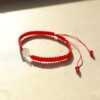 Handgemaakte armband met 14 karaat geelgouden Madeliefje