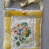 Tas van lief borduurwerk en vintage deken
