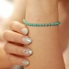 Turkoois armband met 14 karaat geelgouden kralen