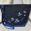 Donkerblauwe jeans schoudertas met geborduurd bladeren-tak