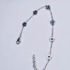 Kleine bloem stalen armband met natuurlijke hematiet stenen