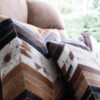 Laura Graveland - koeienhuid sierkussen patchwork - echt leer - zwart, bruin, wit - visgraat - 45cm x 45cm