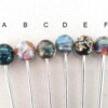 Coctail lepel met handgemaakte glaskraal zwart-bruin