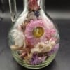 Glazen karafje incl. droogbloemen en een kurk