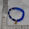 Handgemaakte armband met vergulde bedel - koningsblauw