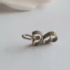 Messing hartjes aan zilveren ketting