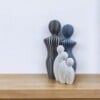 Modern 3d geprint beeldje gezin met 3 kinderen