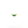 Tiny Facet Emerald Oval Triquetra Gold