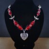 Tranen & Troost, Ketting met hartslot en rood koraal