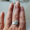 'Love is just a round the corner', open zilveren ring met hartje