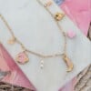 Roze detail bedelketting goud