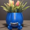 lachende bloempot met boek
