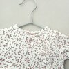 Herinneringshaasje van eerste babykleding