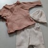 Herinneringshaasje van eerste babykleding