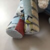 Herinneringsolifant van eerste babykleertjes