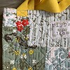 Tote bag van een doorgestikte sprei met bloemen, vlinders en vogels