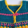Gehaakt baby vestje | Petrol, roze en geel met roze franjes