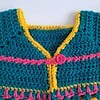 Gehaakt baby vestje | Petrol, roze en geel met roze franjes