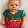Gehaakt baby vestje | Petrol, roze en geel met roze franjes