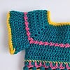 Gehaakt baby vestje | Petrol, roze en geel met roze franjes