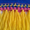 Gehaakte baby vestje | Blauw, roze en geel met gele franjes