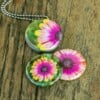 Roestvrij stalen fotomedaillon ketting met drie verschillende verwisselbare voorkanten met close up foto`s in aqua blauw. Rvs/roesvrij stalen fotomedaillon. Voor het dicht bij je dragen van je favoriete foto.