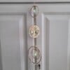 Suncatcher met goudkleurige levensboom en twee prismasterren.