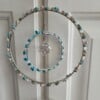 Suncatcher met turquoise en kleine schelpjes.