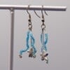 Zeester oorbellen - lichtgewicht & handgemaakt met blauwe glaskralen | Ocean Glow collectie