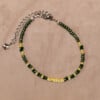 Armband van groene en gele rocailles met zilverkleurige sluiting