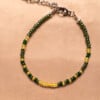 Armband van groene en gele rocailles met zilverkleurige sluiting