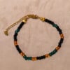 Armband van rocailles in oranje, zwart en donkergroen