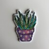 Handgeborduurde magneet vetplantje