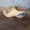 Houten klompjes met blauw MAN loge