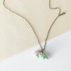 Ketting met roze met groene triceratops hanger