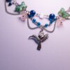 Ketting met kolibri en bloemenkralen
