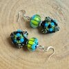 Lentedans & Midzomernacht – Artistieke Lampwork Oorbellen van Glas en Zilver met Modern Folk Feeling