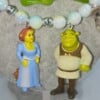 Vintage Shrek en Fiona figuurtjes aan een Statement ketting