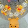 Winnie de Pooh ketting met bijzondere kralen.