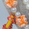 Winnie de Pooh ketting met bijzondere kralen.