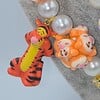 Winnie de Pooh ketting met bijzondere kralen.