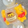 Winnie de Pooh ketting met bijzondere kralen.