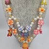 Winnie de Pooh ketting met bijzondere kralen.