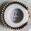Chic & Sensueel, slangenpatroon armband in zwart en goud