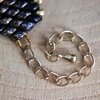 Chic & Sensueel, slangenpatroon armband in zwart en goud